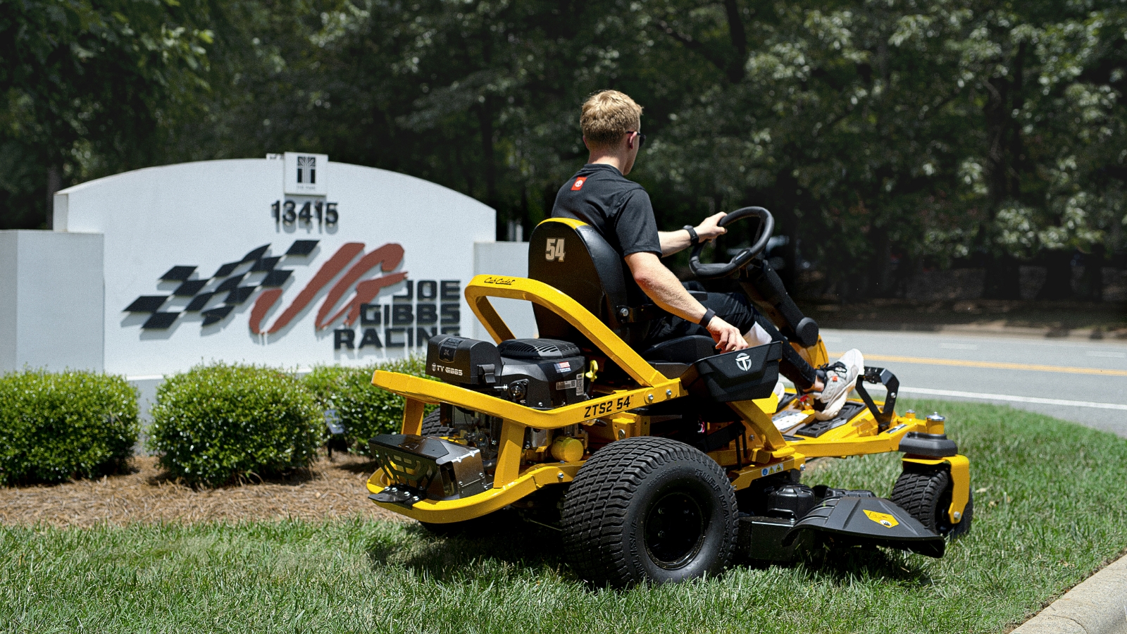 Ty Gibbs mowing outside on a Cub Cadet ZTS mower